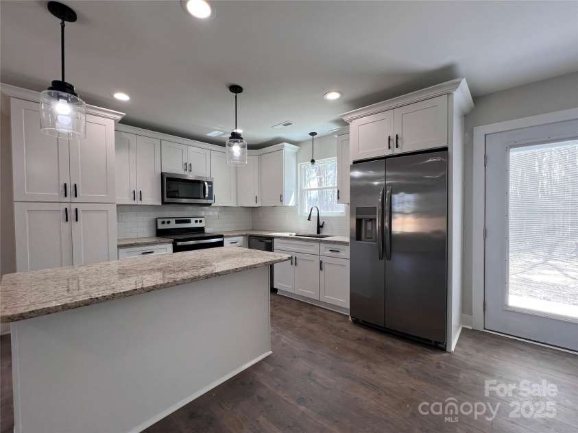 1600 Russell Courtney Road, Monroe, NC 28112.  MLS# CAR4276315, YatesRealty ID 24514. Sample kitchen with typical finishes