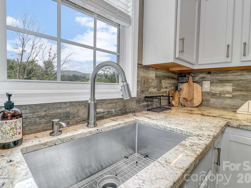 25 Union Chapel Road, Weaverville, NC 28787.  MLS# CAR4346426, YatesRealty ID 24517. Wash Dishes with a View