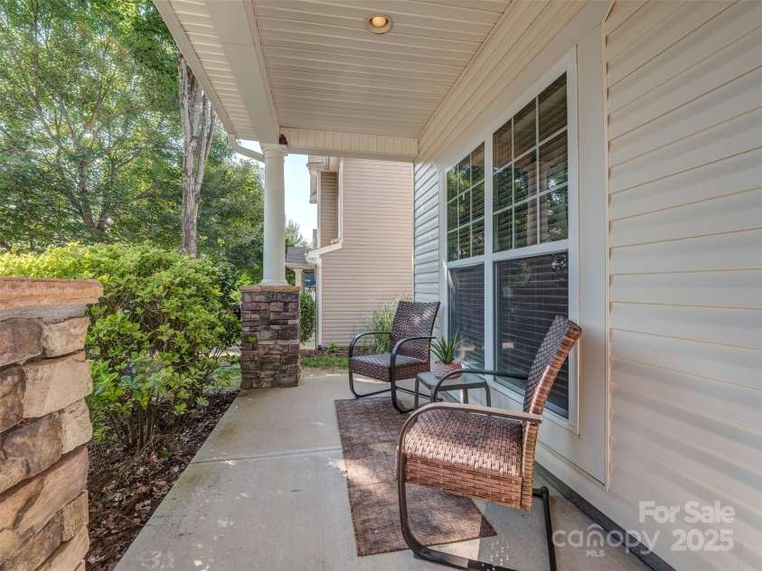3511 Dominion Green Drive, Charlotte, NC 28269.  MLS# CAR4272819, YatesRealty ID 24518. Covered rocking chair front porch