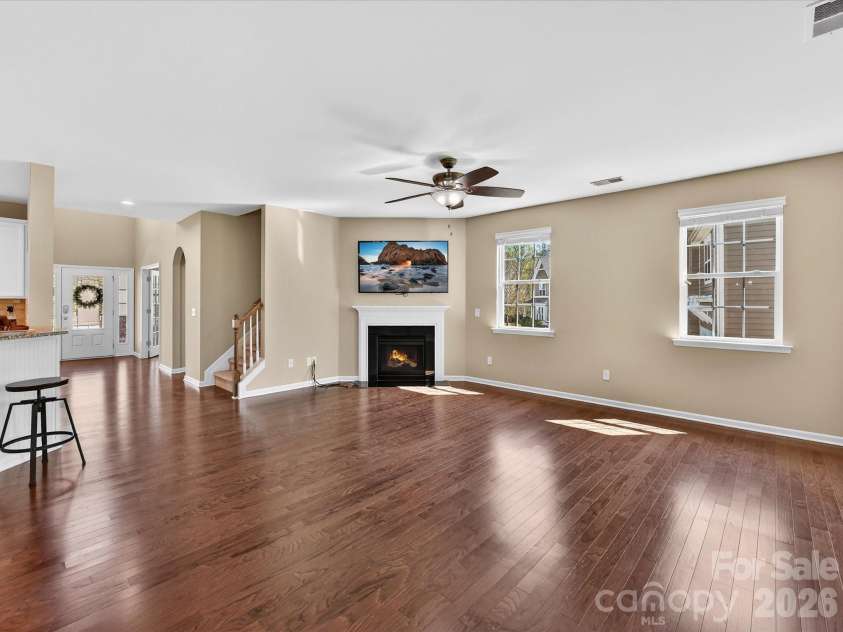 3504 Ringtail Drive, Waxhaw, NC 28173.  MLS# CAR4359232, YatesRealty ID 24519. Family Room w/ Corner Gas Fireplace. TV to Remain! Ceiling Fan, Hardwood Flooring & Plenty of Windows!