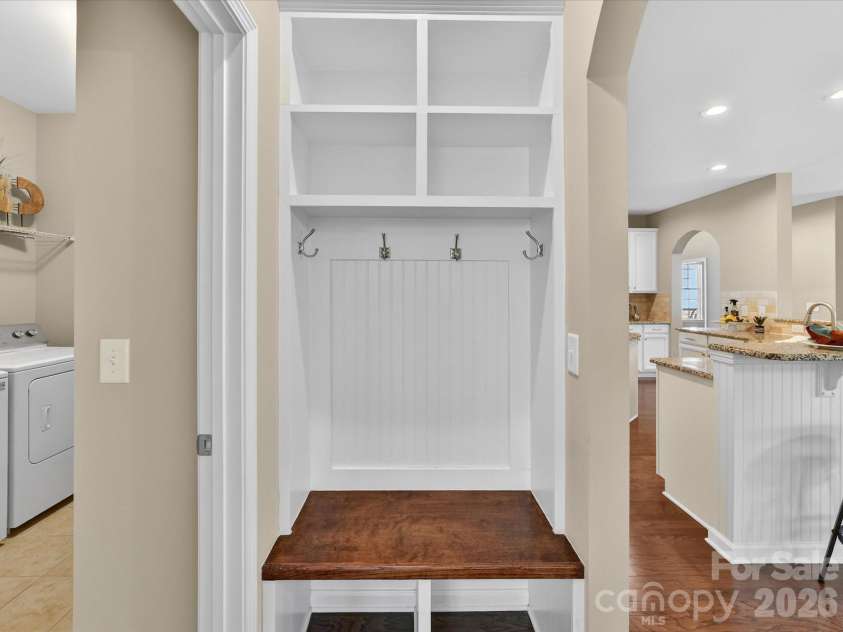 3504 Ringtail Drive, Waxhaw, NC 28173.  MLS# CAR4359232, YatesRealty ID 24519. Main Level Drop Zone added with Cubbies, Shelving, Hooks & Beadboard is located between Kitchen and Laundry