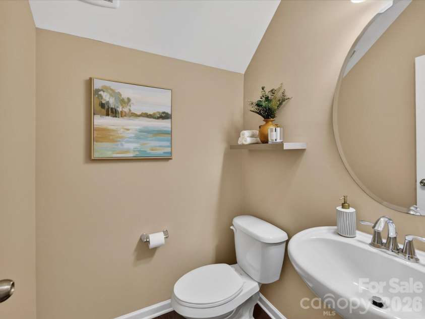3504 Ringtail Drive, Waxhaw, NC 28173.  MLS# CAR4359232, YatesRealty ID 24519. Main Level Guest Powder Room on Main level with Hardwood Flooring and Pedestal Sink
