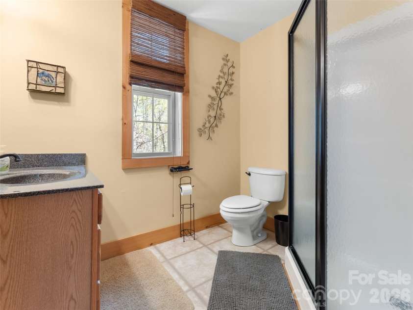462 Deep Woods Lane, Saluda, NC 28773.  MLS# CAR4366925, YatesRealty ID 24522. Ensuite bathroom with shower