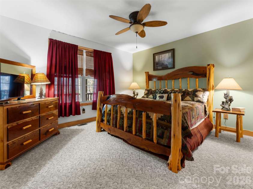 462 Deep Woods Lane, Saluda, NC 28773.  MLS# CAR4366925, YatesRealty ID 24522. Main level bedroom with walkin closet.