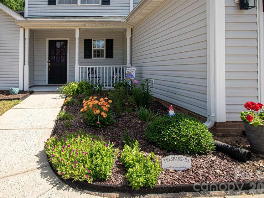 4708 Titus Court, Monroe, NC 28110.  MLS# CAR4371611, YatesRealty ID 24524. Nicely landscaped walkway!
