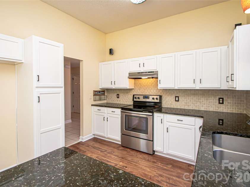4708 Titus Court, Monroe, NC 28110.  MLS# CAR4371611, YatesRealty ID 24524. Recently refinished cabinets!