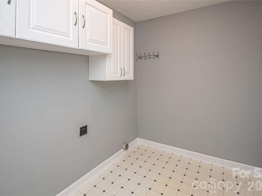 4708 Titus Court, Monroe, NC 28110.  MLS# CAR4371611, YatesRealty ID 24524. Spacious main level laundry room!