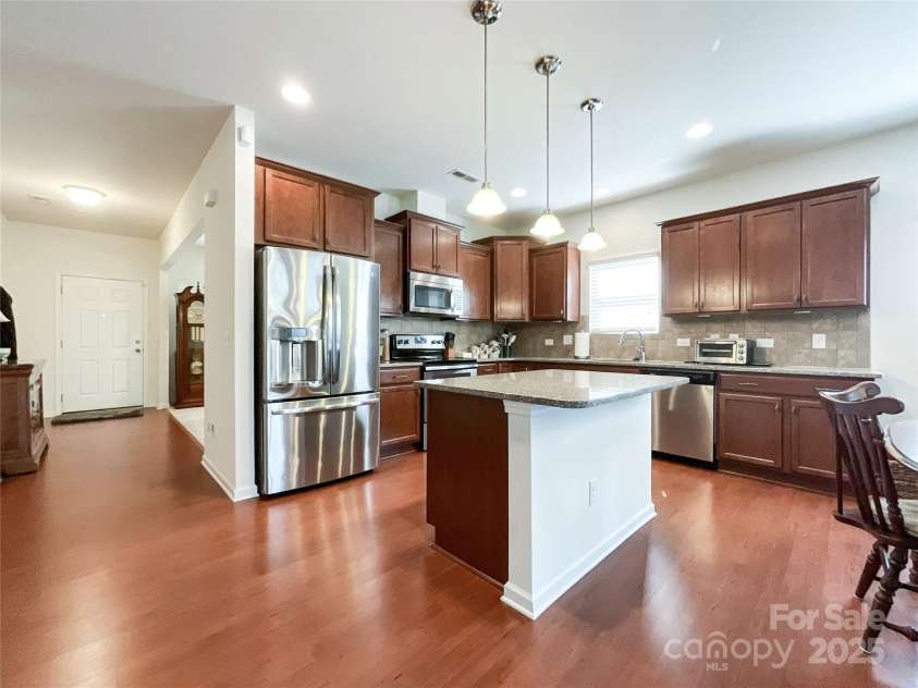 1228 Tranquil Falls Lane, Matthews, NC 28104.  MLS# CAR4265694, YatesRealty ID 24525. 