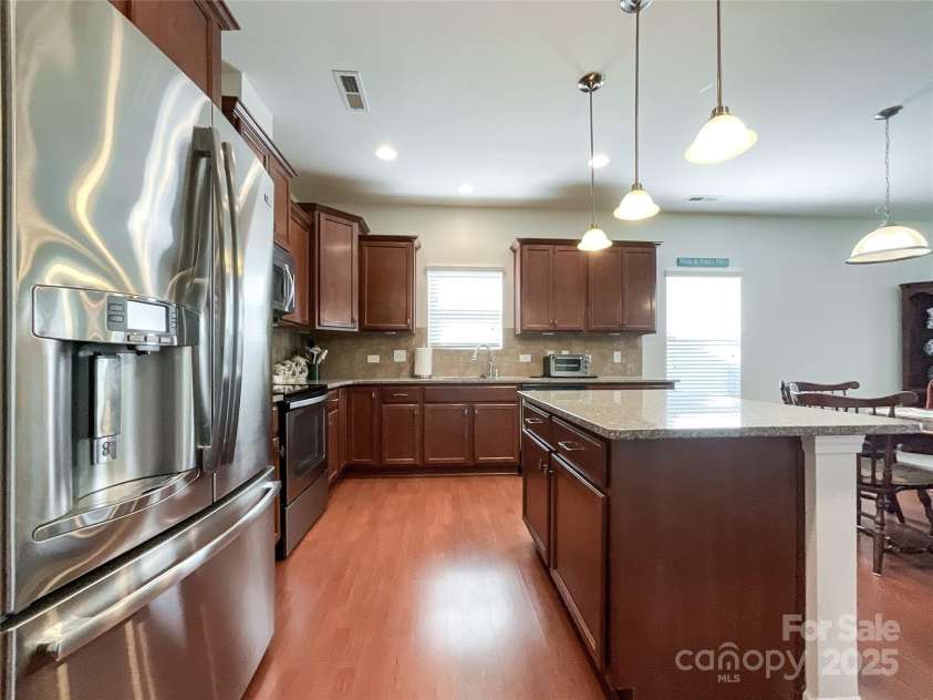 1228 Tranquil Falls Lane, Matthews, NC 28104.  MLS# CAR4265694, YatesRealty ID 24525. 