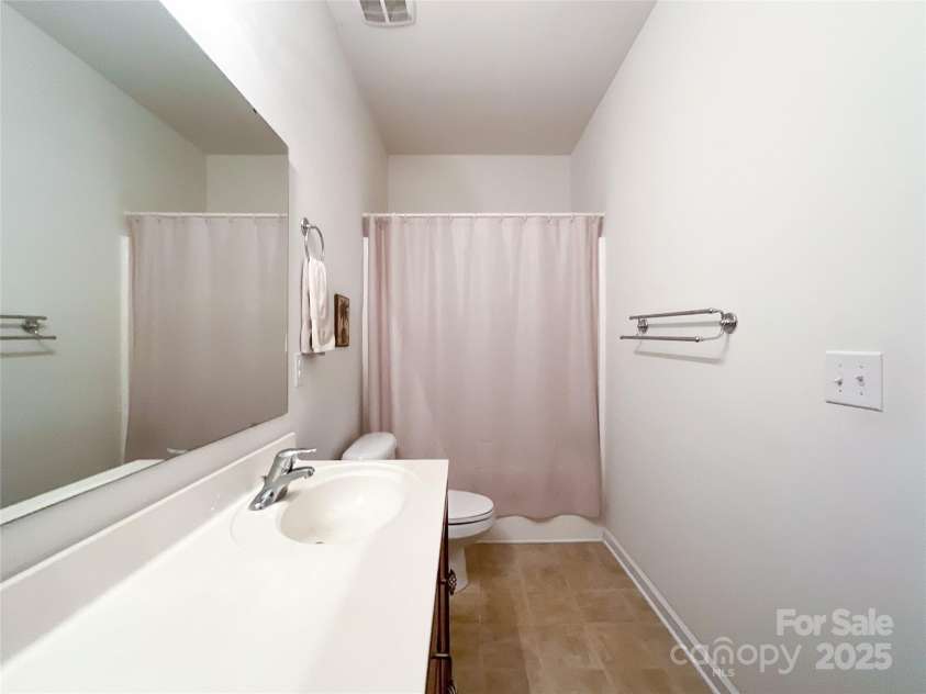 1228 Tranquil Falls Lane, Matthews, NC 28104.  MLS# CAR4265694, YatesRealty ID 24525. 