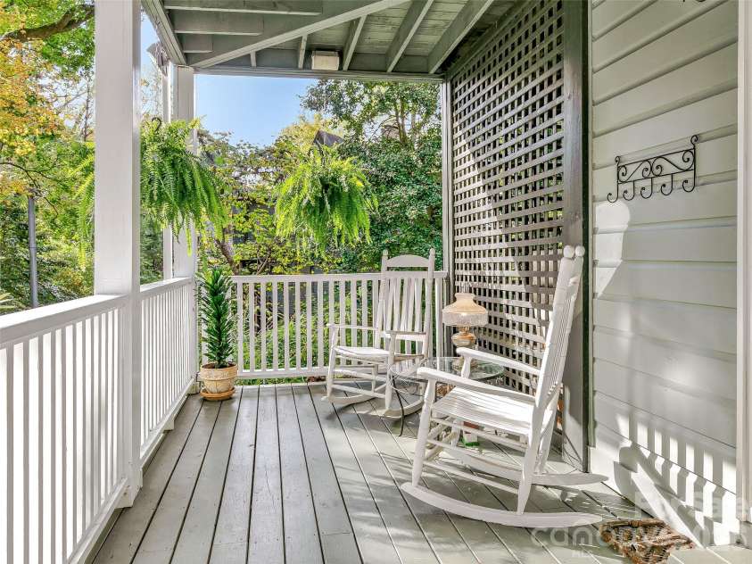 67 Cherokee Road, Asheville, NC 28801.  MLS# CAR4339931, YatesRealty ID 24525. Tranquil Lower Level Porch Off Primary Suite
