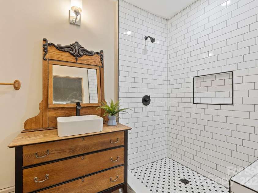 203 Davis Mountain Road, Laurel Park, NC 28739.  MLS# CAR4237042, YatesRealty ID 24540. Basement level, remodeled full bathroom