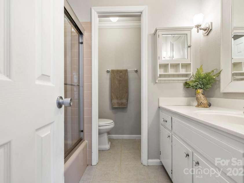 203 Davis Mountain Road, Laurel Park, NC 28739.  MLS# CAR4237042, YatesRealty ID 24540. Primary bathroom, shower/tub combination, neutral decor