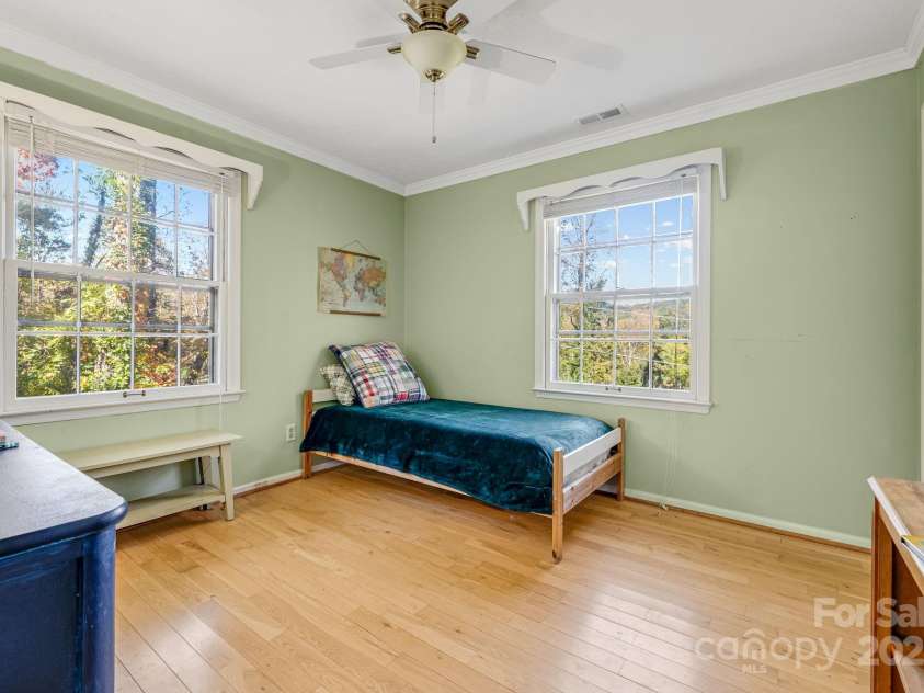203 Davis Mountain Road, Laurel Park, NC 28739.  MLS# CAR4332728, YatesRealty ID 24540. Corner secondary bedroom with plentiful natural light