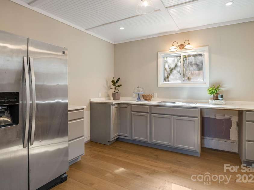 203 Davis Mountain Road, Laurel Park, NC 28739.  MLS# CAR4332728, YatesRealty ID 24540. Lower level second kitchen space, customize this space with your finishes