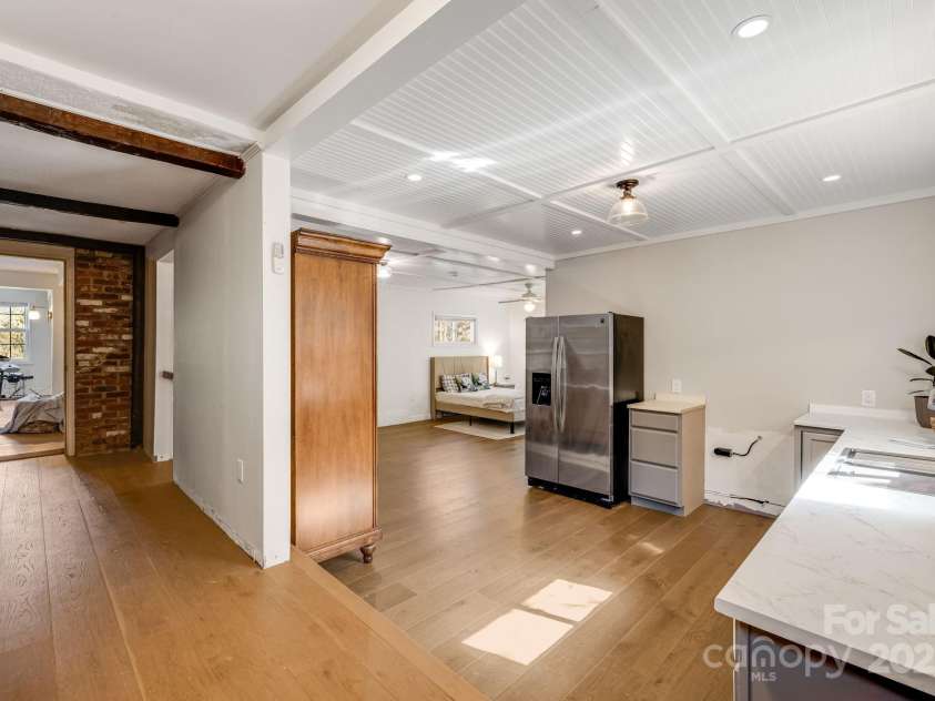 203 Davis Mountain Road, Laurel Park, NC 28739.  MLS# CAR4332728, YatesRealty ID 24540. Lower level second living space - bedroom, bathroom, kitchen and laundry