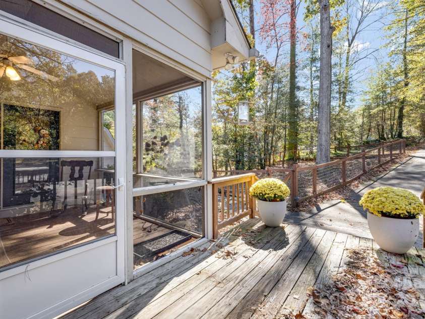 203 Davis Mountain Road, Laurel Park, NC 28739.  MLS# CAR4332728, YatesRealty ID 24540. Screened porch, small deck and fenced yard space