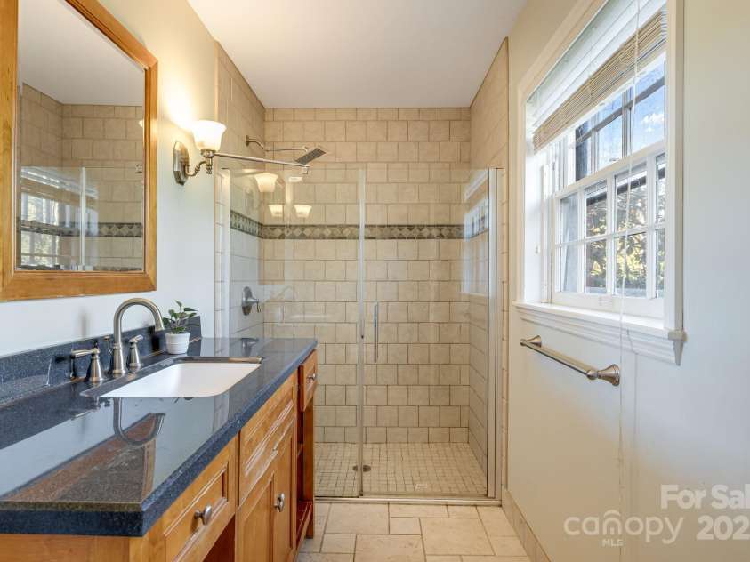 203 Davis Mountain Road, Laurel Park, NC 28739.  MLS# CAR4332728, YatesRealty ID 24540. Updated full bathroom, tiled shower