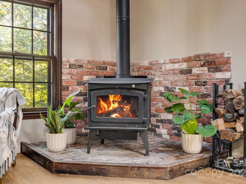 203 Davis Mountain Road, Laurel Park, NC 28739.  MLS# CAR4332728, YatesRealty ID 24540. Wood-burning fireplace in the living room