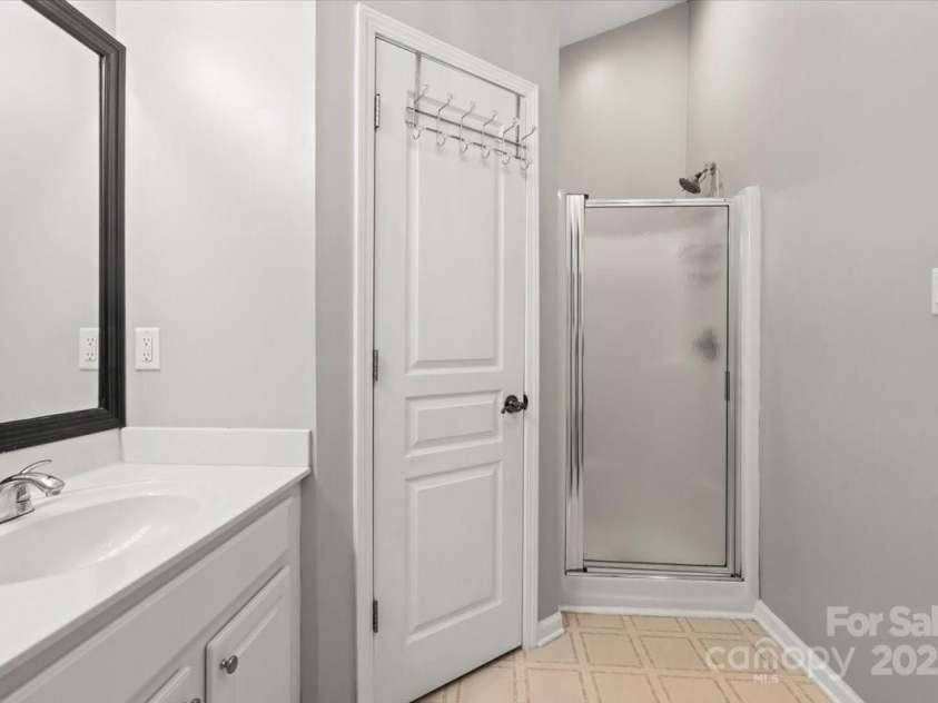 2527 Fossil Stone Lane, Fort Mill, SC 29708.  MLS# CAR4271300, YatesRealty ID 24545. Shower in primary bathroom