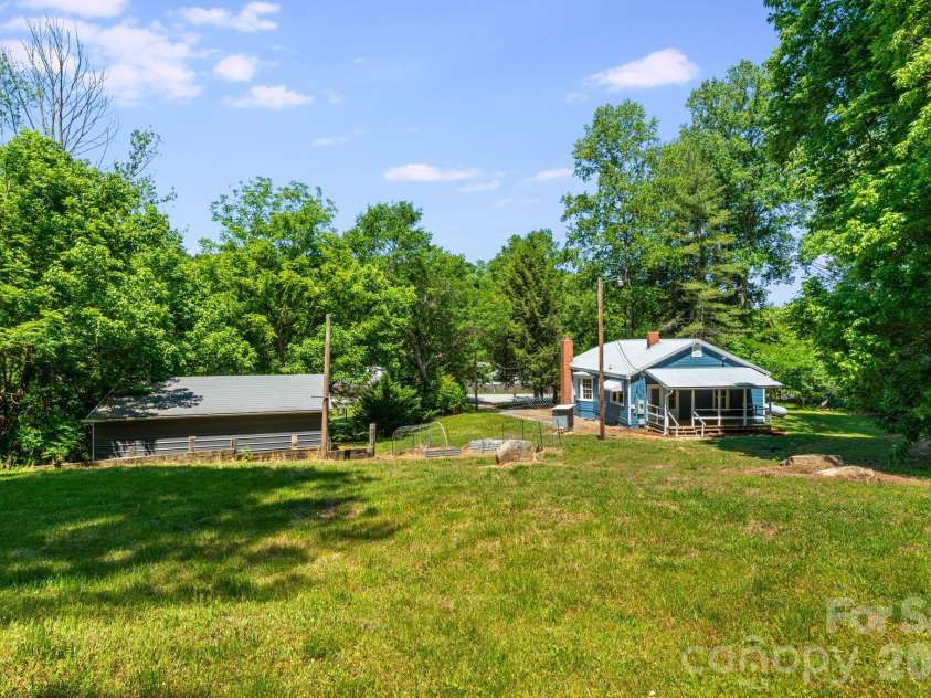 141 Coxe Road, Rutherfordton, NC 28139.  MLS# CAR4383067, YatesRealty ID 24548. Home and Garage View from Back Yard