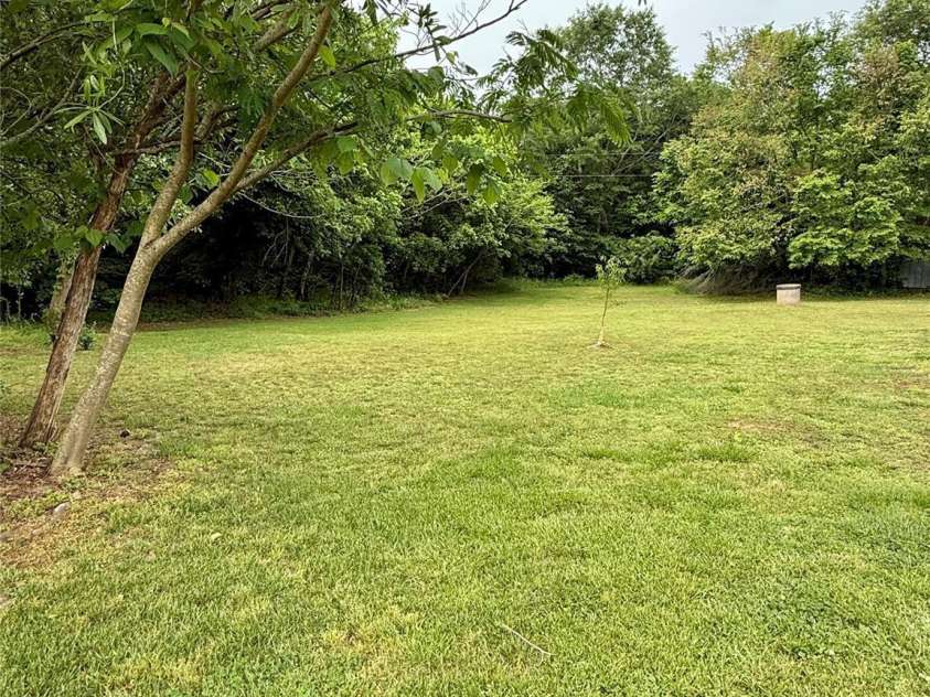 214 Double Shoals Road, Lawndale, NC 28090.  MLS# CAR4256264, YatesRealty ID 24548. Back yard behind fencing