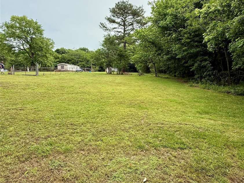 214 Double Shoals Road, Lawndale, NC 28090.  MLS# CAR4256264, YatesRealty ID 24548. Right side of house-yard