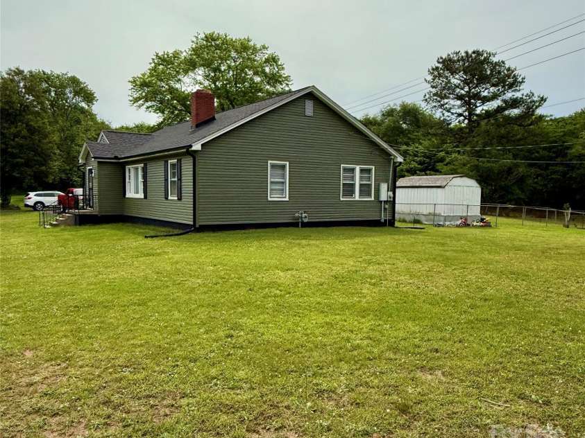 214 Double Shoals Road, Lawndale, NC 28090.  MLS# CAR4256264, YatesRealty ID 24548. Side yard