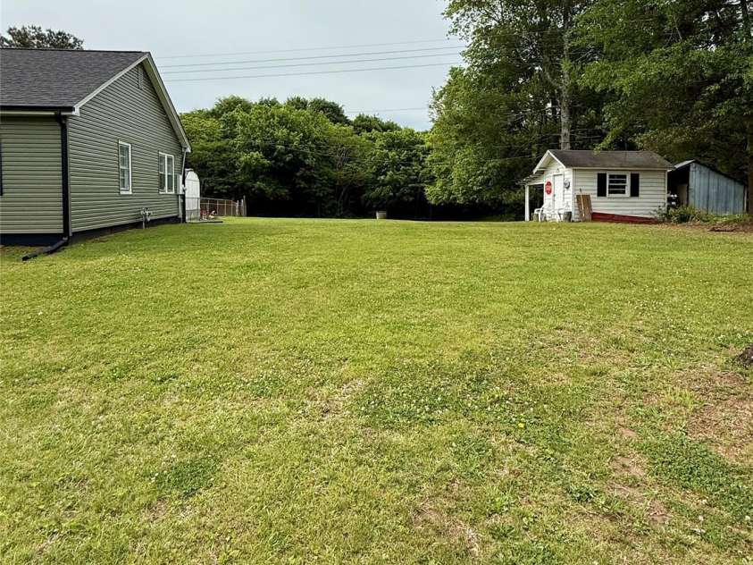214 Double Shoals Road, Lawndale, NC 28090.  MLS# CAR4256264, YatesRealty ID 24548. Side yard