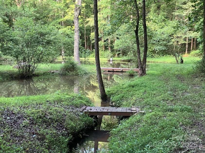 5425 Creek Run Court, Kings Mountain, NC 28086.  MLS# CAR4270104, YatesRealty ID 24553. Bridges crossing pond to island