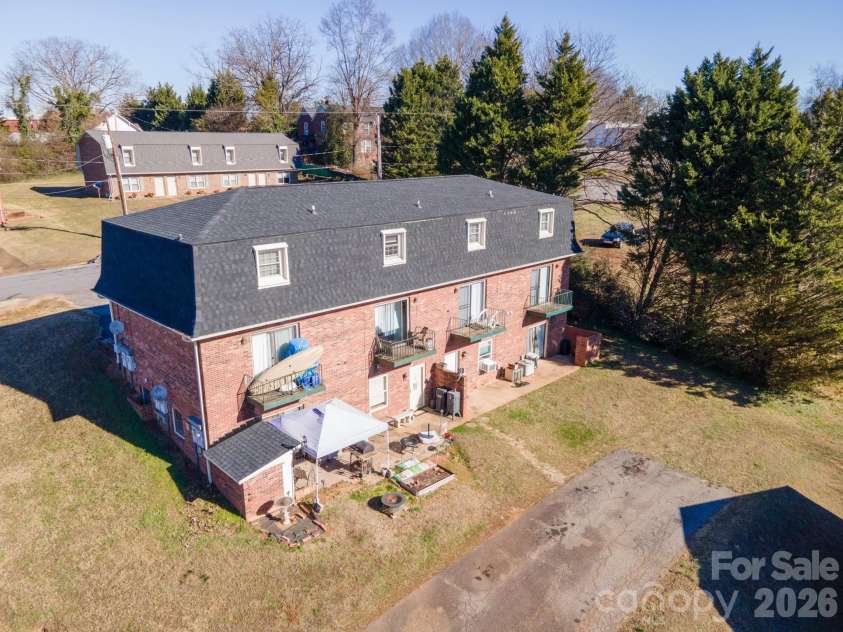 18 Berkley Avenue, Granite Falls, NC 28630.  MLS# CAR4336892, YatesRealty ID 2456. Back of Upper Building - Two Basement Apartments with 2 Bedrooms and 1 Full Bath 
