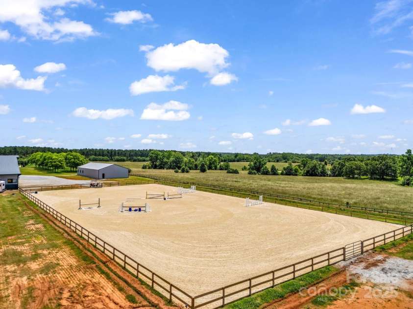 1550 Airport Road, Rutherfordton, NC 28139.  MLS# CAR4277211, YatesRealty ID 24561. 120 x 240 arean with textile enhanced footing.