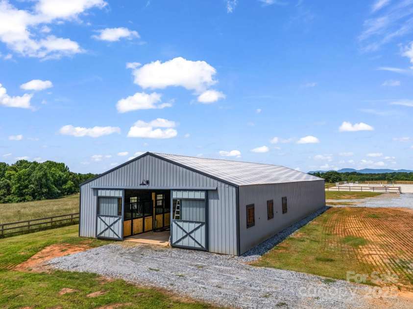 1550 Airport Road, Rutherfordton, NC 28139.  MLS# CAR4277211, YatesRealty ID 24561. 6 stall stallion barn with small indoor arena potential.