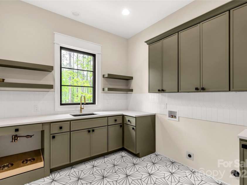 3268 Sherman Drive, Lancaster, SC 29720.  MLS# CAR4244022, YatesRealty ID 24562. Laundry room with pet feeding station and TONS of storage