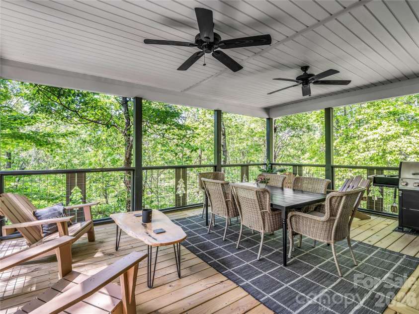 737 Melrose Mountain Road, Tryon, NC 28782.  MLS# CAR4380872, YatesRealty ID 24564. Covered Deck - Perfection in the trees!