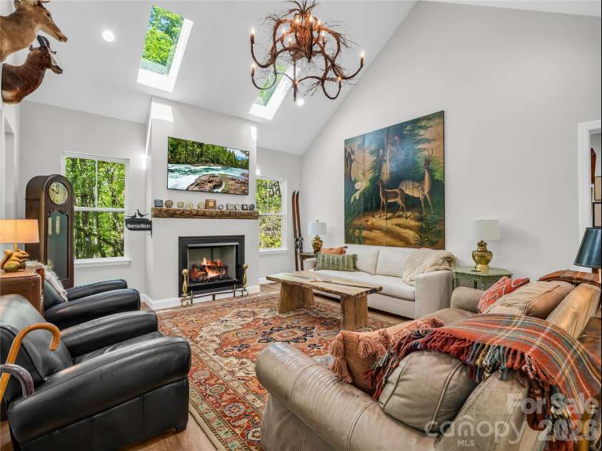 737 Melrose Mountain Road, Tryon, NC 28782.  MLS# CAR4380872, YatesRealty ID 24564. Great Room with Skylights