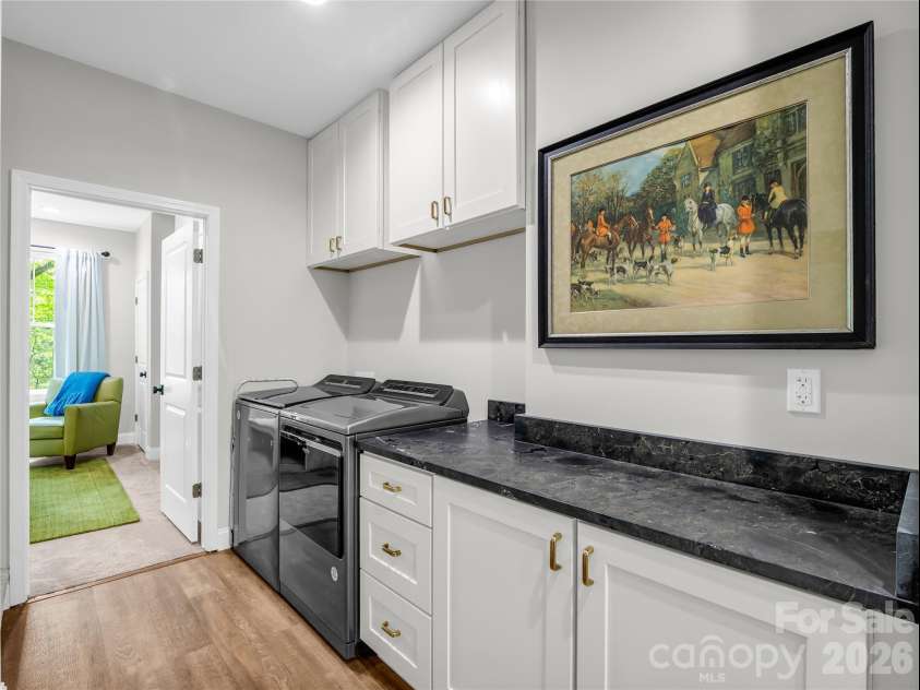 737 Melrose Mountain Road, Tryon, NC 28782.  MLS# CAR4380872, YatesRealty ID 24564. Hallway Laundry