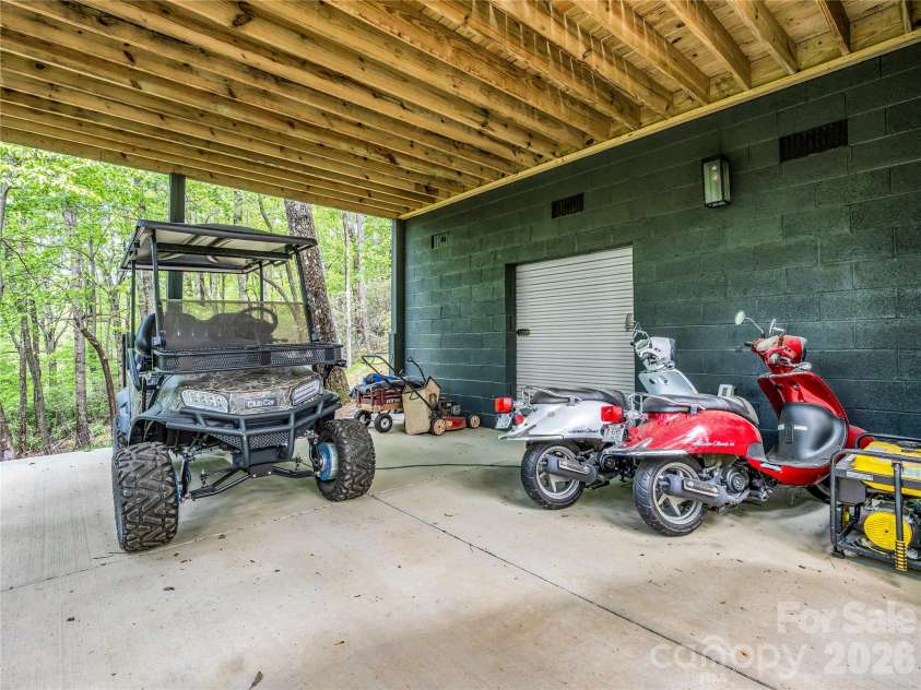 737 Melrose Mountain Road, Tryon, NC 28782.  MLS# CAR4380872, YatesRealty ID 24564. Under deck storage area