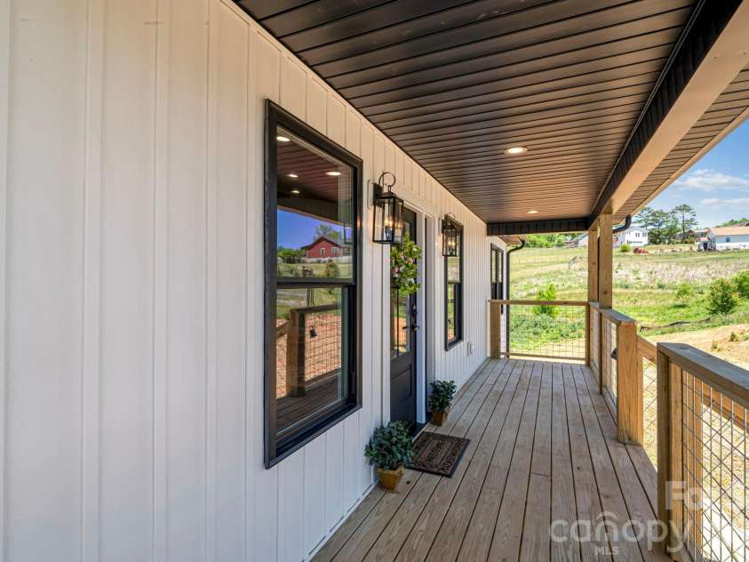 33 Pilgrims Path Lane, Alexander, NC 28701.  MLS# CAR4374090, YatesRealty ID 24567. Covered Front Porch