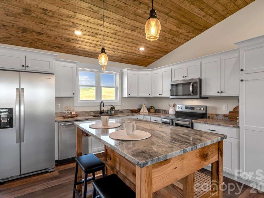 33 Pilgrims Path Lane, Alexander, NC 28701.  MLS# CAR4374090, YatesRealty ID 24567. Custom Kitchen Island/Breakfast Bar