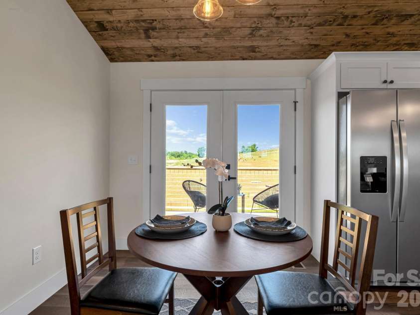 33 Pilgrims Path Lane, Alexander, NC 28701.  MLS# CAR4374090, YatesRealty ID 24567. Dining area with back deck access