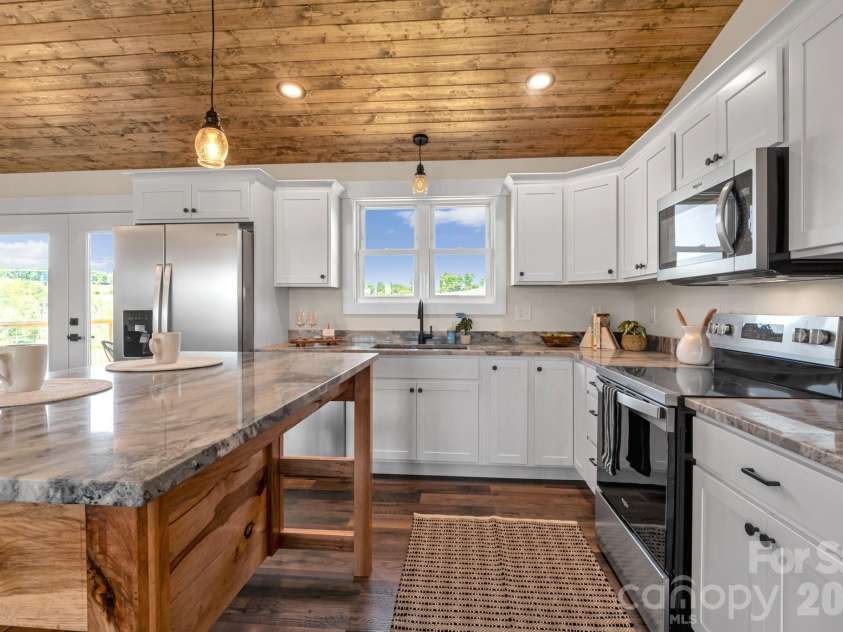 33 Pilgrims Path Lane, Alexander, NC 28701.  MLS# CAR4374090, YatesRealty ID 24567. Kitchen and Island