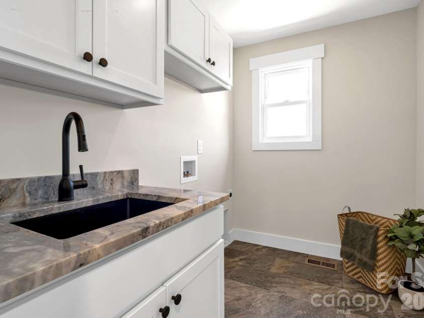 33 Pilgrims Path Lane, Alexander, NC 28701.  MLS# CAR4374090, YatesRealty ID 24567. Spacious Laundry Room w/sink