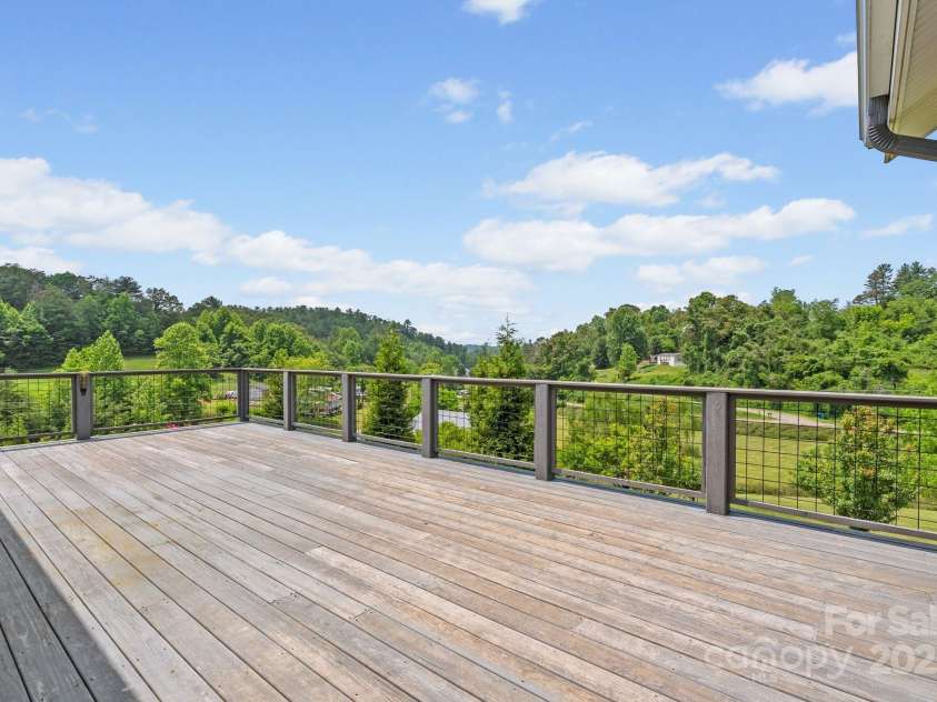 41 Bell Sprinkle Road, Weaverville, NC 28787.  MLS# CAR4268060, YatesRealty ID 24576. Expansive deck space