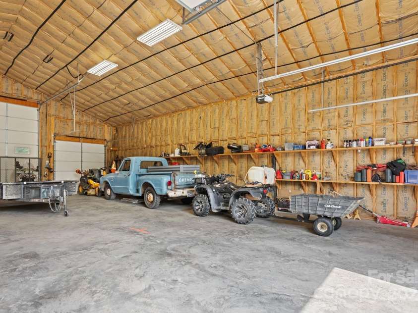 41 Bell Sprinkle Road, Weaverville, NC 28787.  MLS# CAR4268060, YatesRealty ID 24576. Large Shop or garage with 12 ft Doors