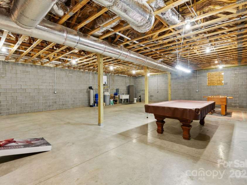 41 Bell Sprinkle Road, Weaverville, NC 28787.  MLS# CAR4268060, YatesRealty ID 24576. Large unfinished basement with 10 ft ceilings