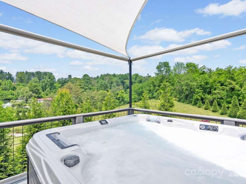41 Bell Sprinkle Road, Weaverville, NC 28787.  MLS# CAR4268060, YatesRealty ID 24576. Shaded hot tub