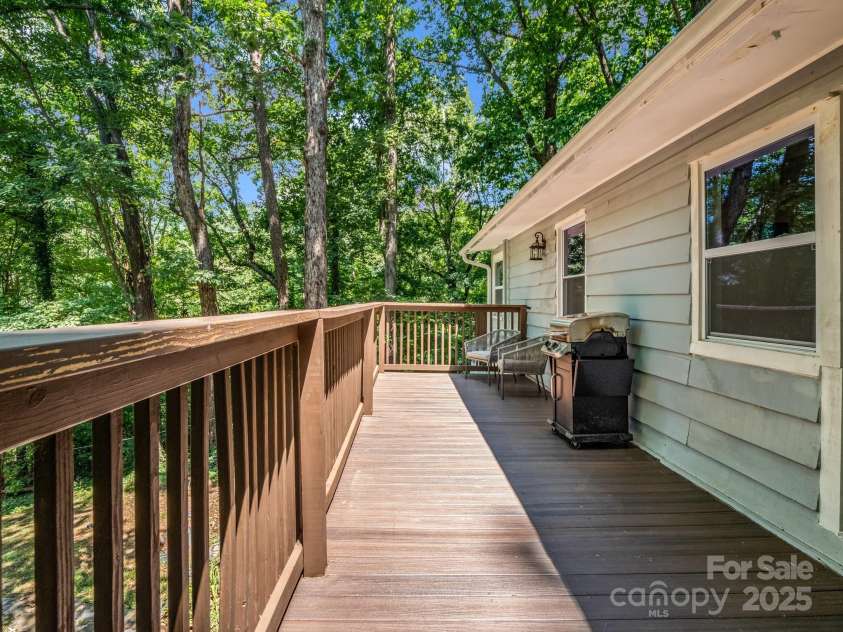 1463 Carolina Drive, Tryon, NC 28782.  MLS# CAR4275838, YatesRealty ID 24578. Back deck is off of the living room