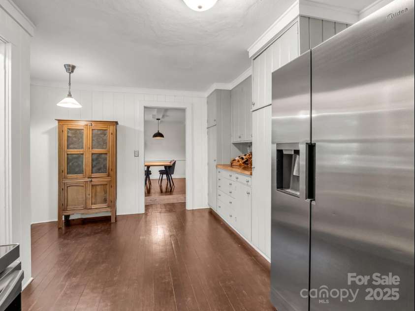 1463 Carolina Drive, Tryon, NC 28782.  MLS# CAR4275838, YatesRealty ID 24578. Breakfast area on the left