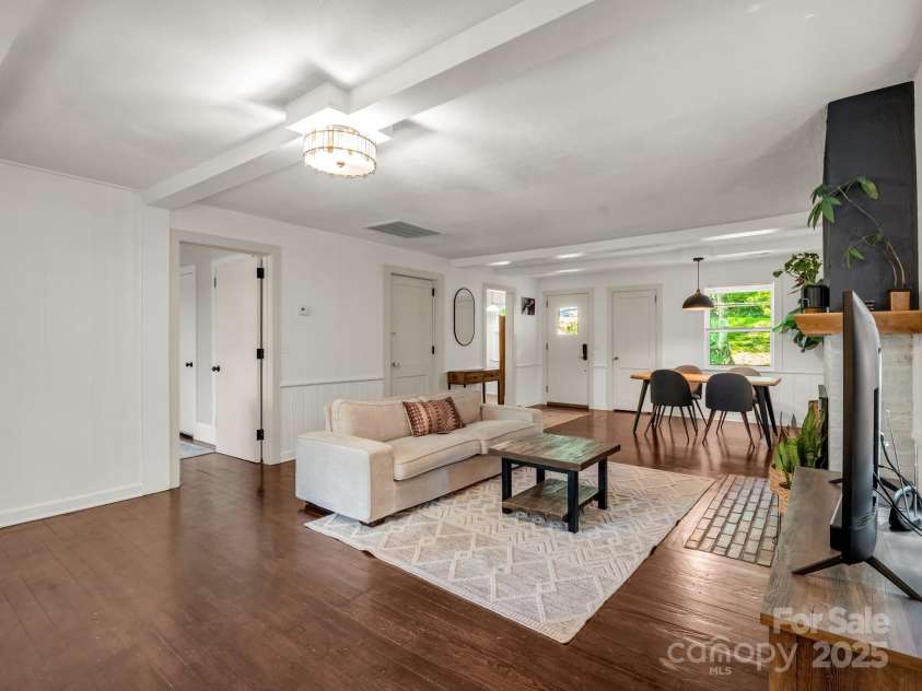 1463 Carolina Drive, Tryon, NC 28782.  MLS# CAR4275838, YatesRealty ID 24578. Door to the primary suite is on the left.